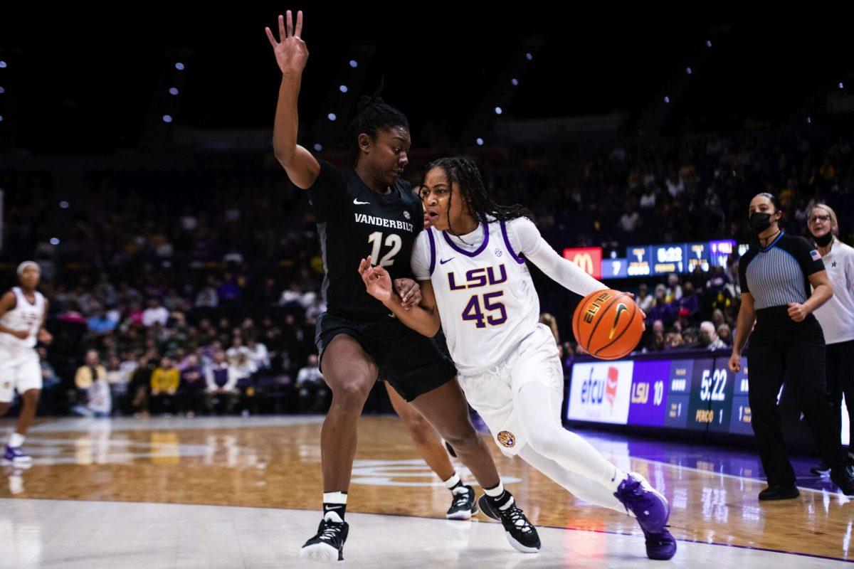 LSU women’s basketball fifth year senior guard Alexis Morris (45) drives past a Vanderbilt women’s basketball junior guard Demi Washington (12) Sunday, Jan. 16, 2022, during LSU’s 82-64 win against Vanderbilt in the Pete Maravich Assembly Center on North Stadium Drive in Baton Rouge, La.