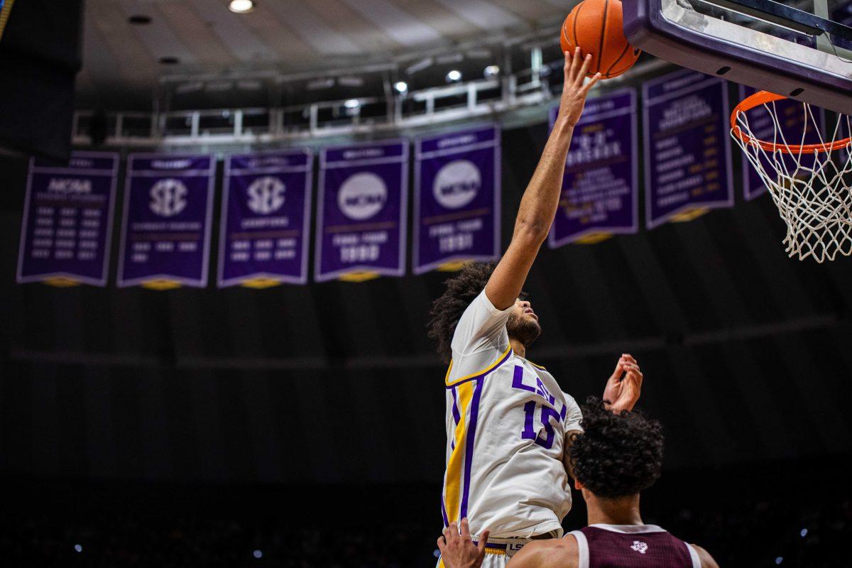 LSU men&#8217;s basketball freshman center Efton Reid III (15) attempts a lay-up Wednesday, Jan. 26, 2022, during LSU&#8217;s 70-64 win against Texas A&amp;M in the Pete Maravich Assembly Center on North Stadium Drive in Baton Rouge, La.