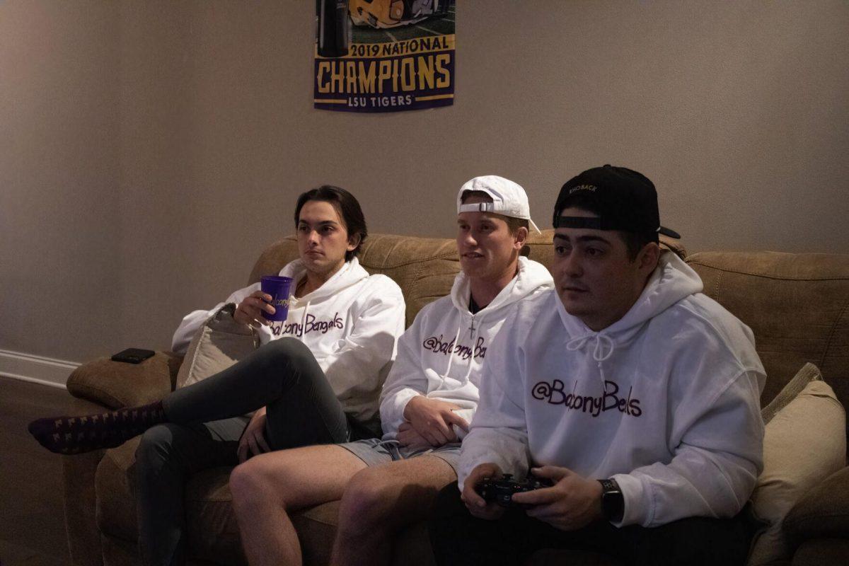 Brandon Barrient, Myles Diez and Gant Gautreaux kickback in their apartment. 