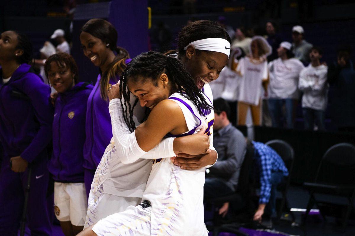 LSU women’s basketball graduate student center Faustine Aifuwa (24) embraces senior guard Alexis Morris (45) Thursday, Jan. 13, 2022, after LSU’s 87-85 overtime win against Missouri in the Pete Maravich Assembly Center on North Stadium Drive in Baton Rouge, La.