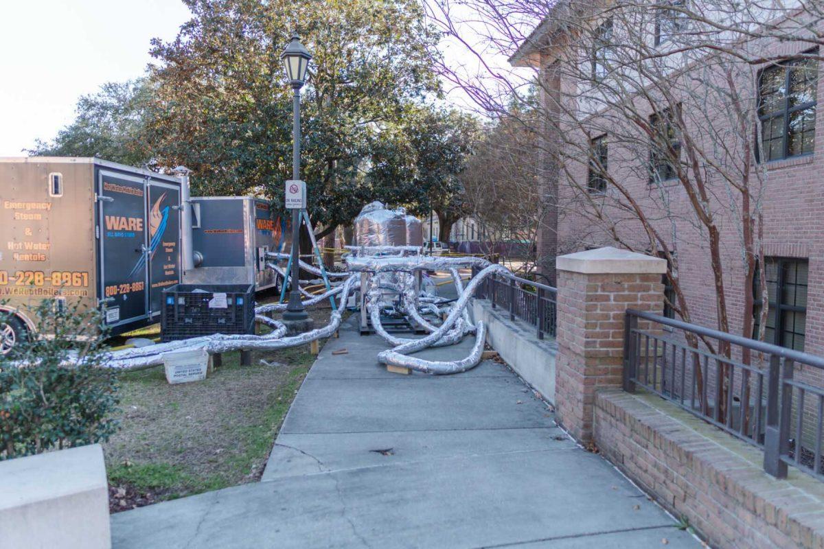 A network of pipes pump water on Sunday, Jan. 23, 2022, into South Hall on Cypress Drive in Baton Rouge, La.