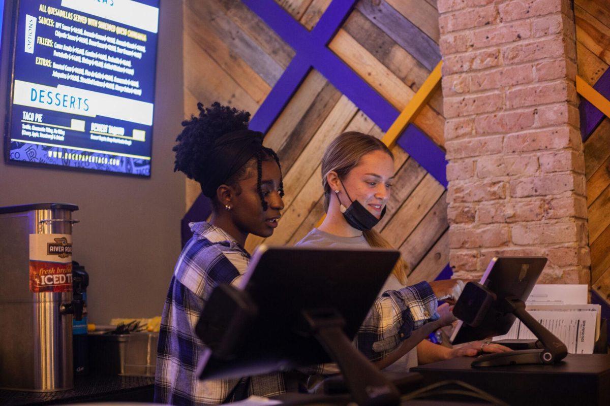 LSU nursing sophomore Taylor Vance and LSU psychology freshman Olivia Baig work the cashier Tuesday, Jan. 18, 2022, at Rock Paper Taco on 166 W Chimes St. in Baton Rouge, La.