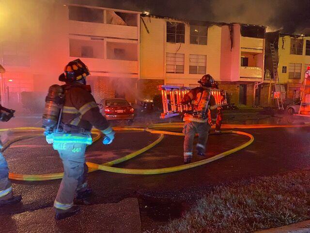 Baton Rouge firefighters respond to a large apartment fire at the Bradshaw Apartment Homes Friday night.&#160;