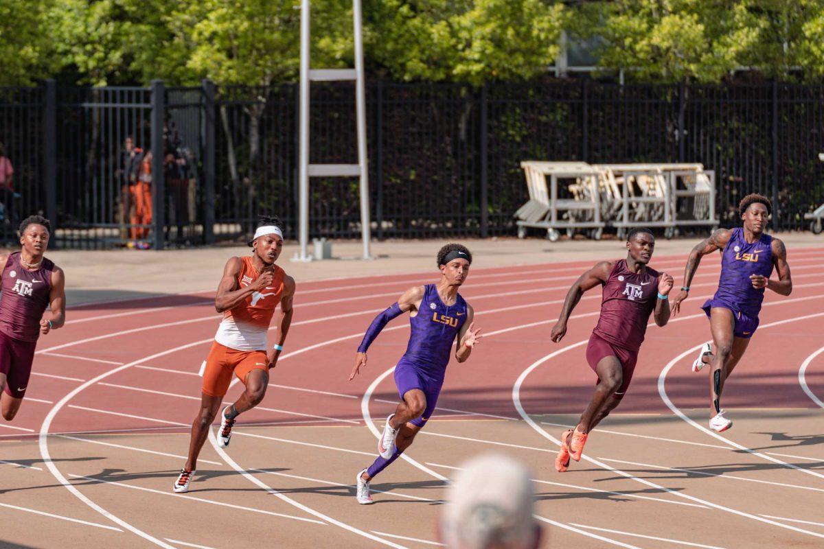 LSU track and field senior Terrance Laird (left) and sophomore Charles Lewis (right) compete in the 200-meter dash on April 24, 2021 at the LSU Alumni Gold meet at Bernie Moore Track Stadium on North Stadium Drive in Baton Rouge.