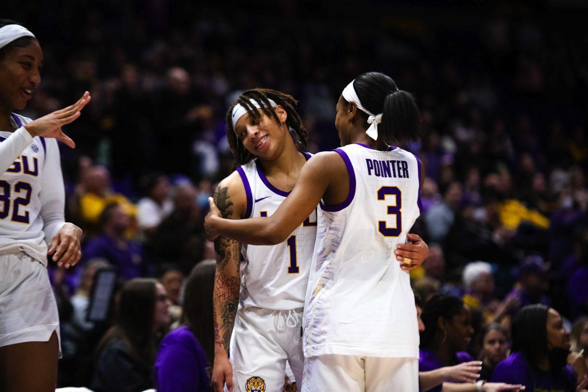 LSU women&#8217;s basketball graduate student guard Khayla Pointer (3) wraps her arms around graduate student guard Jailin Cherry (1) after she&#8217;s subbed out the game Sunday, Jan. 16, 2022, during LSU&#8217;s 82-64 win against Vanderbilt in the Pete Maravich Assembly Center on North Stadium Drive in Baton Rouge, La.