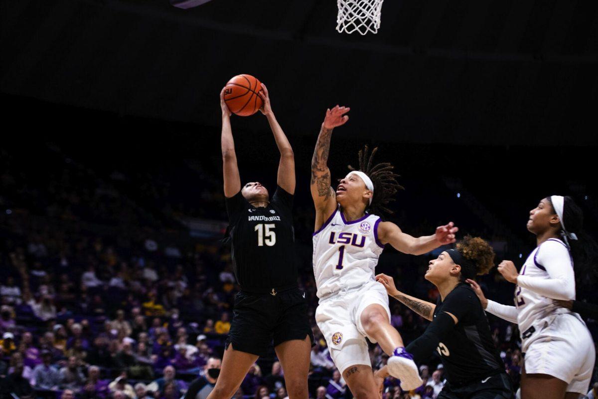 LSU women’s basketball graduate student guard Jailin Cherry (1) tries to grab the ball from Vanderbilt women’s basketball senior forward Brinae Alexander (15) Sunday, Jan. 16, 2022, during LSU’s 82-64 win against Vanderbilt in the Pete Maravich Assembly Center on North Stadium Drive in Baton Rouge, La.