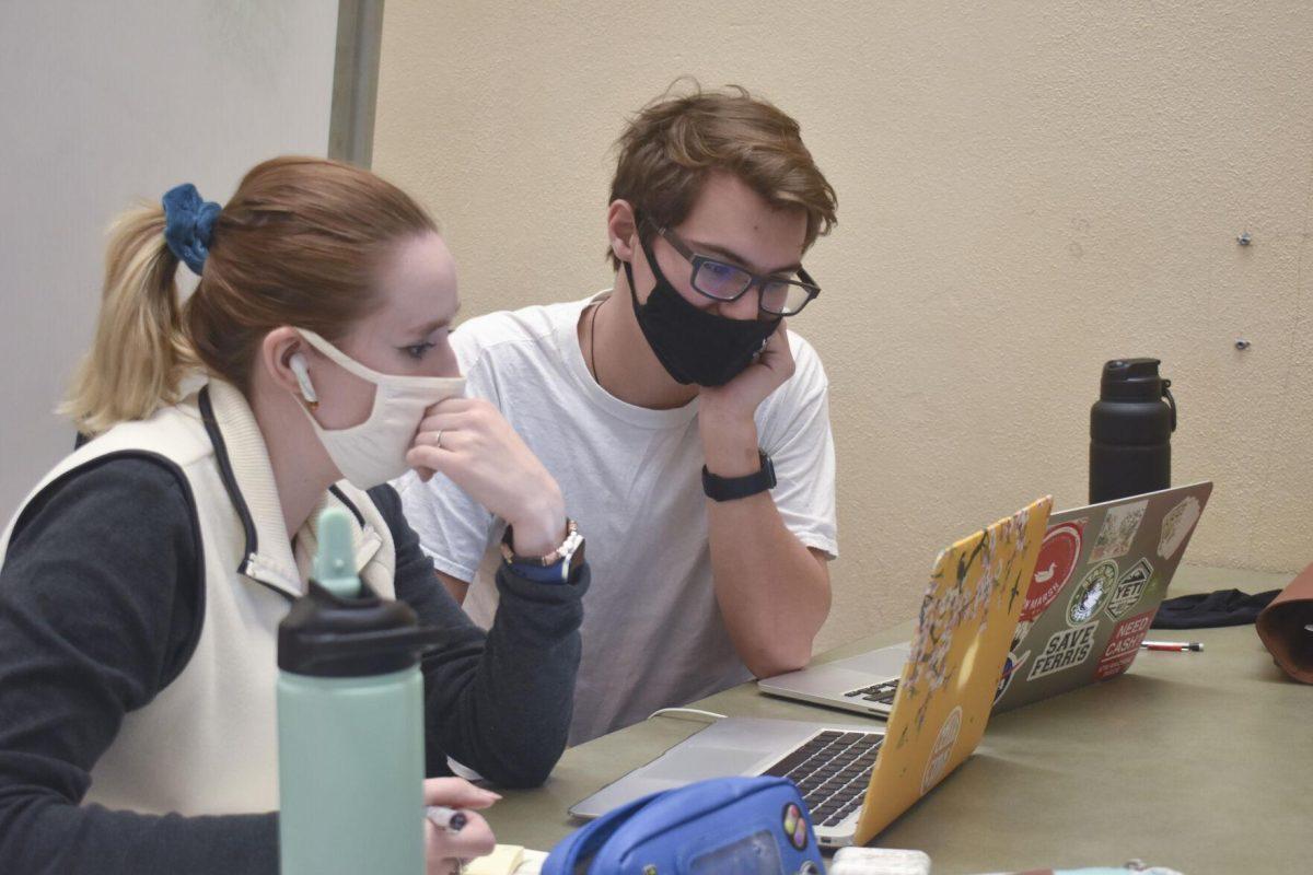 LSU French Secondary Education junior Olivia Stearns and History Secondary Education senior John Fleming work together Tuesday, Jan. 18, 2022, at LSU library in Baton Rouge, La.