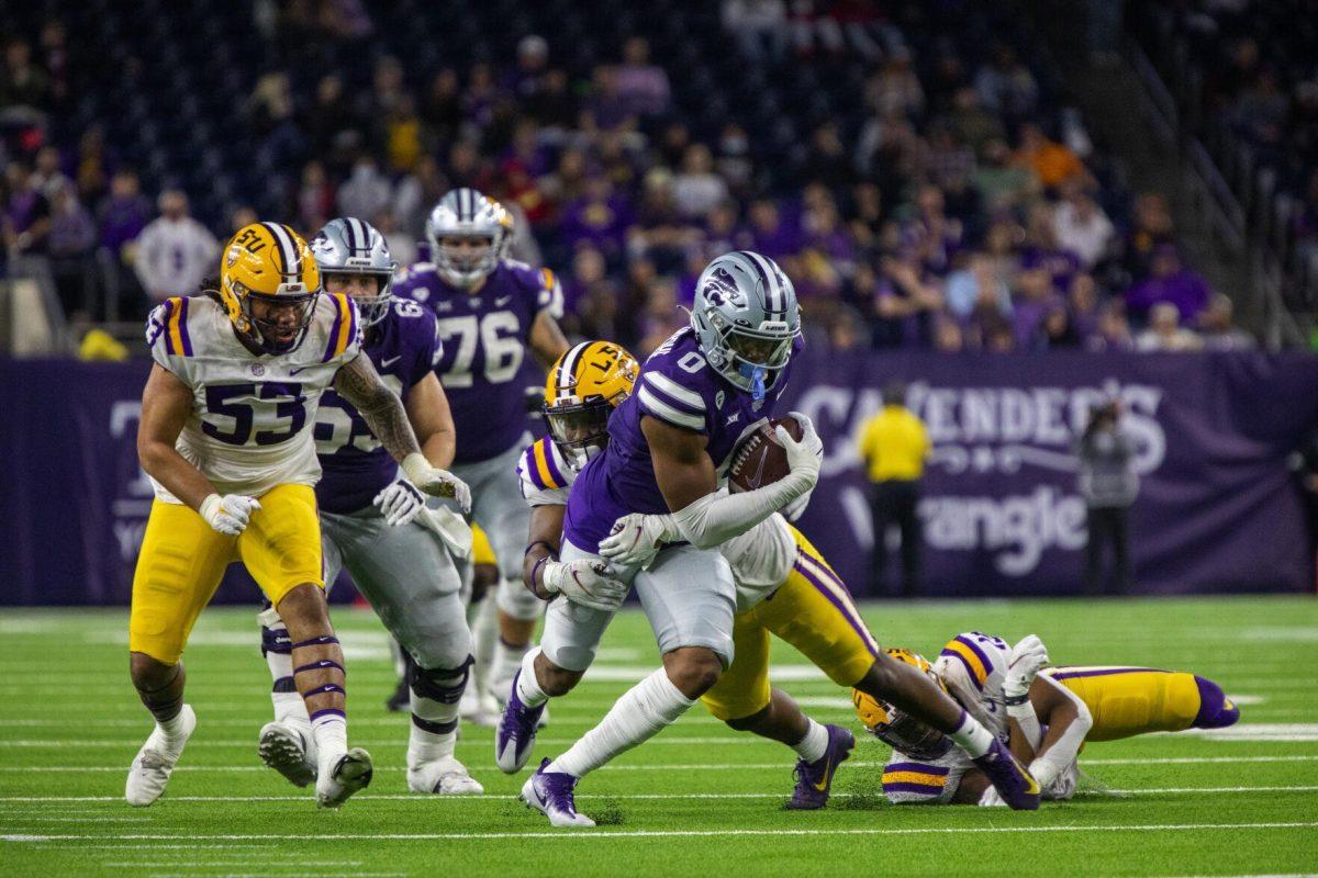 LSU football freshman linebacker Greg Penn III (30) makes a tackle Tuesday, Jan. 4, 2022, during LSU&#8217;s 42-20 loss against Kansas State at NRG Stadium in Houston, TX.