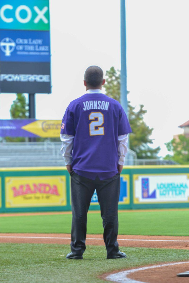 LSU baseball Head Coach Jay Johnson gazes up at the Alex Box Stadium scoreboard at his introduction on June 28, 2021.&#160;