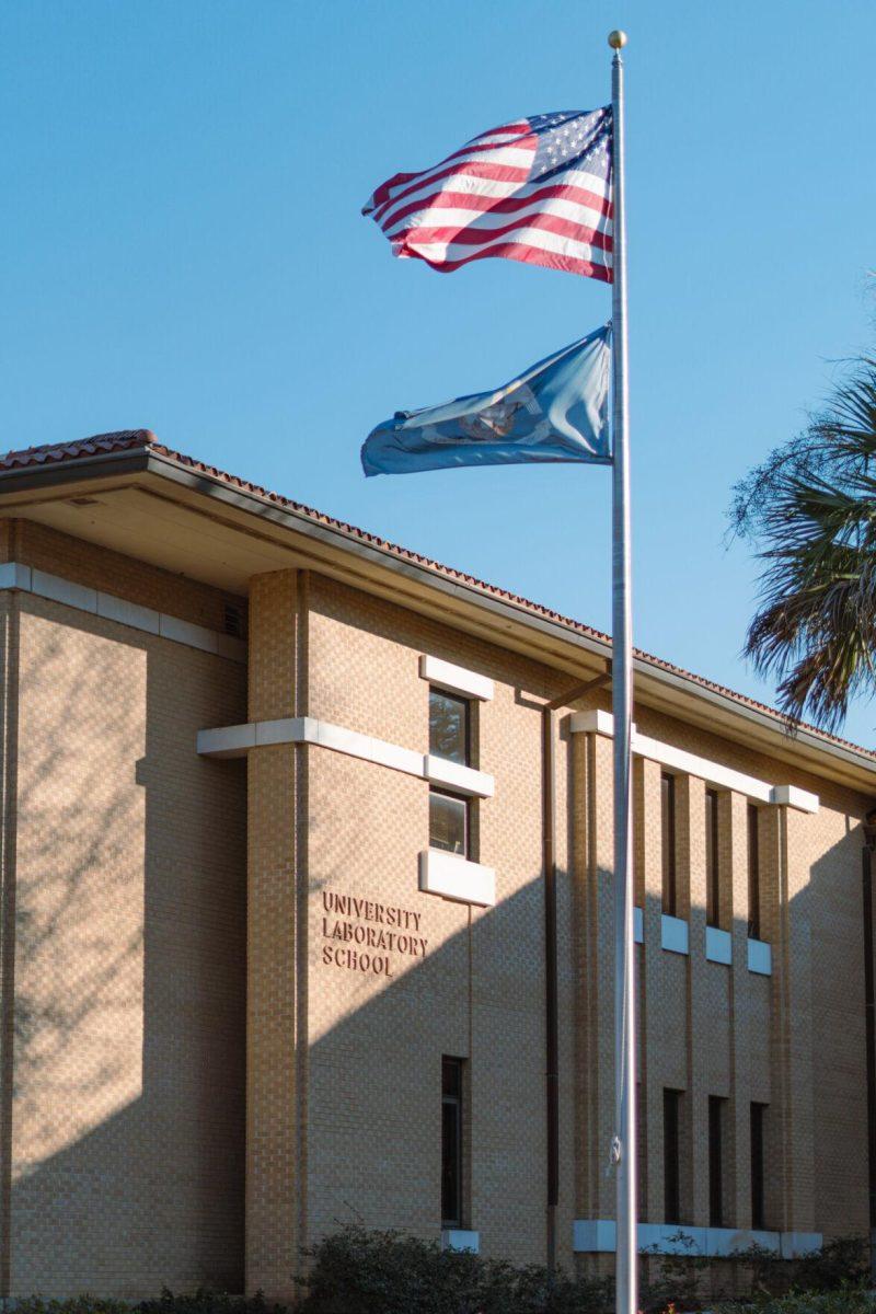 Flags fly in front of the University Laboratory School on Sunday, Jan. 16, 2022, at 45 Dalrymple Drive on LSU&#8217;s campus in Baton Rouge, La.