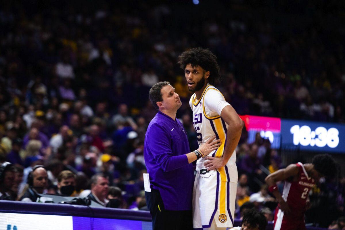 LSU men's basketball head coach Will Wade speaks to LSU men's basketball freshman center Efton Reid (15) Saturday, Jan. 15, 2022, during LSU’s 65-58 loss against Arkansas in the Pete Maravich Assembly Center on North Stadium Drive in Baton Rouge, La.