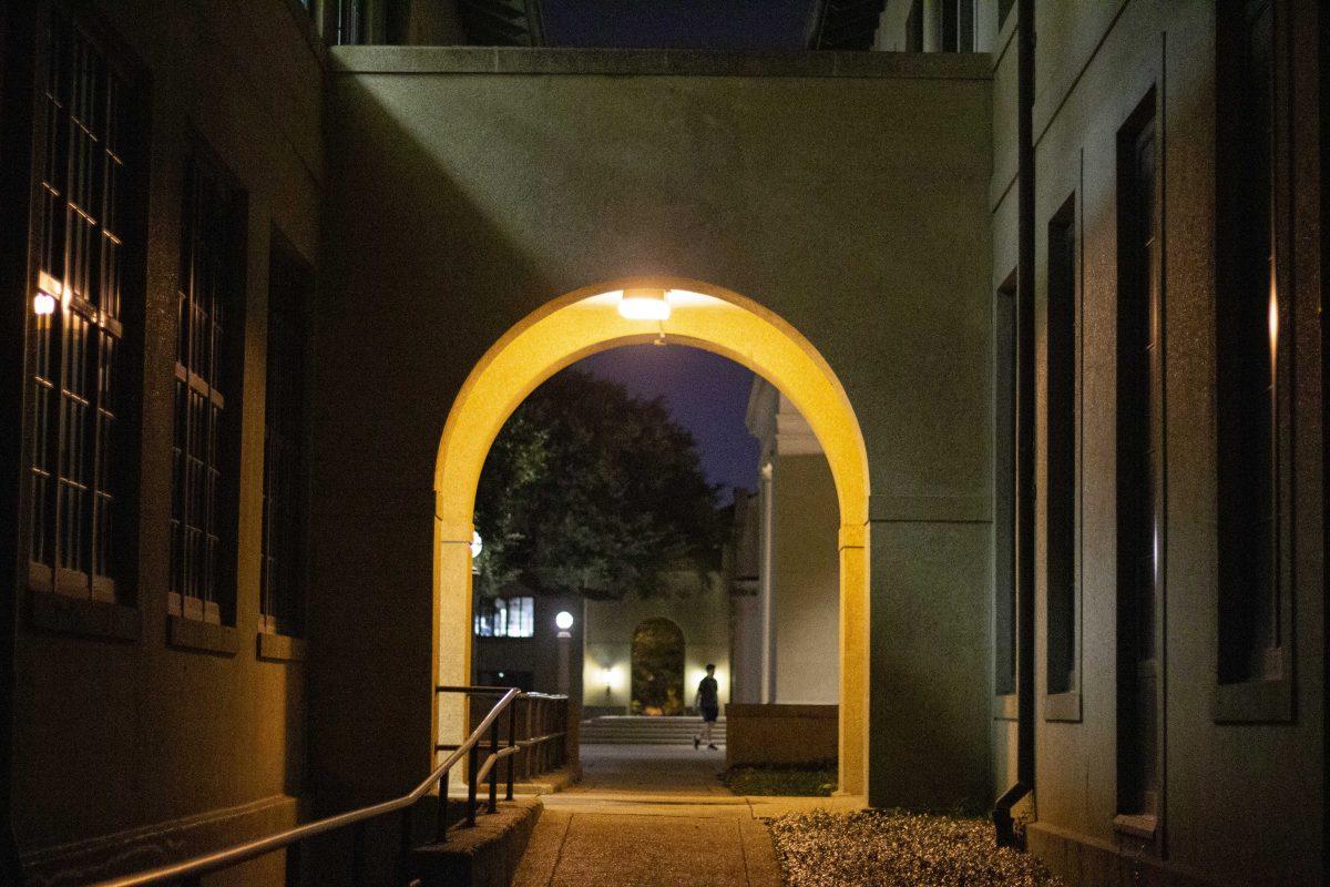 An archway leading to Memorial Tower glows at night on LSU's Campus, Tuesday, Aug. 24, 2021.