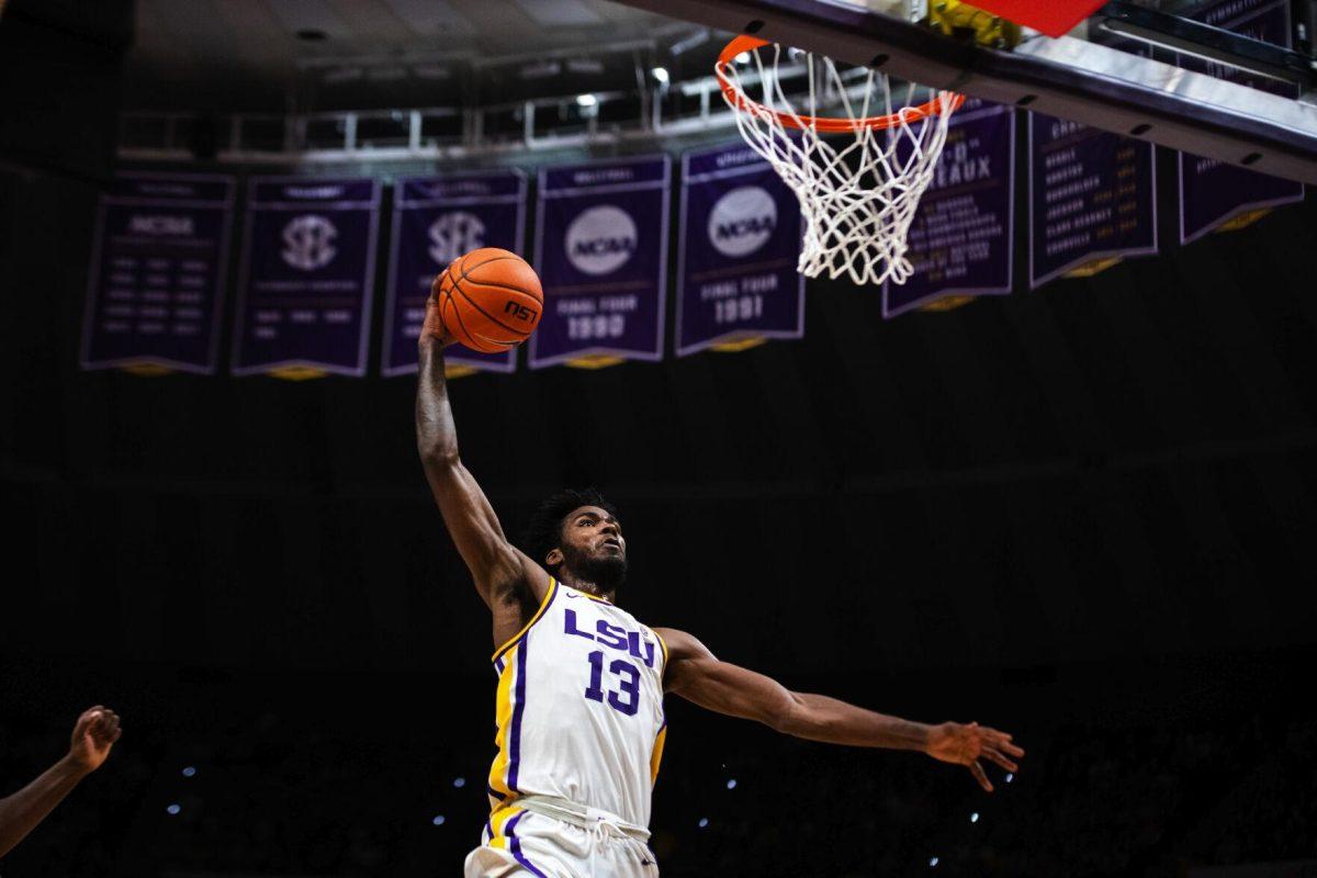 LSU men’s basketball sophomore forward Tari Eason (13) rises up for a dunk Jan. 15, 2022, during LSU’s 65-58 loss against Arkansas in the Pete Maravich Assembly Center on North Stadium Drive in Baton Rouge, La.