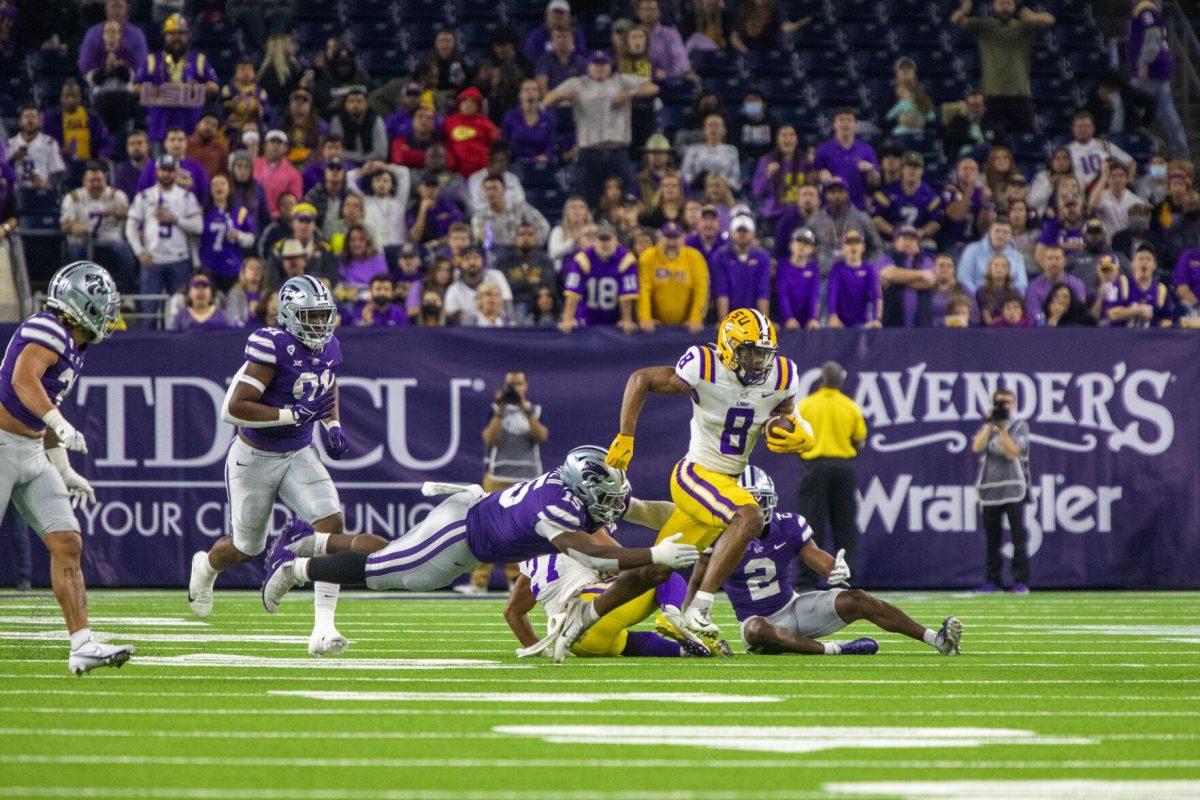 LSU football freshman wide receiver Malik Nabers (8) sprints for a gain of yards Tuesday, Jan. 4, 2022, during LSU&#8217;s 42-20 loss against Kansas State at NRG Stadium in Houston, TX.