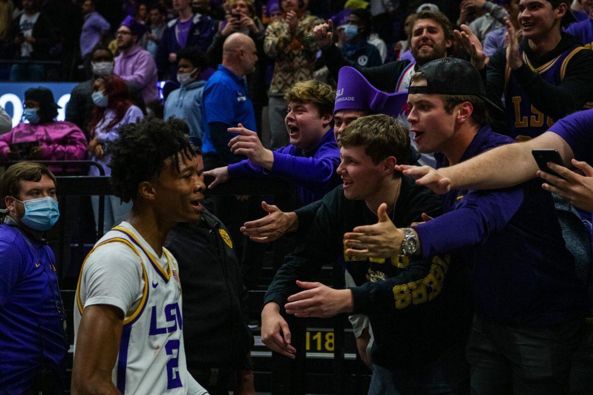 LSU men&#8217;s basketball sophomore guard Eric Gaines (2) high fives the student section Tuesday, Jan. 04, 2022, after LSU&#8217;s 56-50 win against Kentucky in the Pete Maravich Assembly Center on North Stadium Drive in Baton Rouge, La.