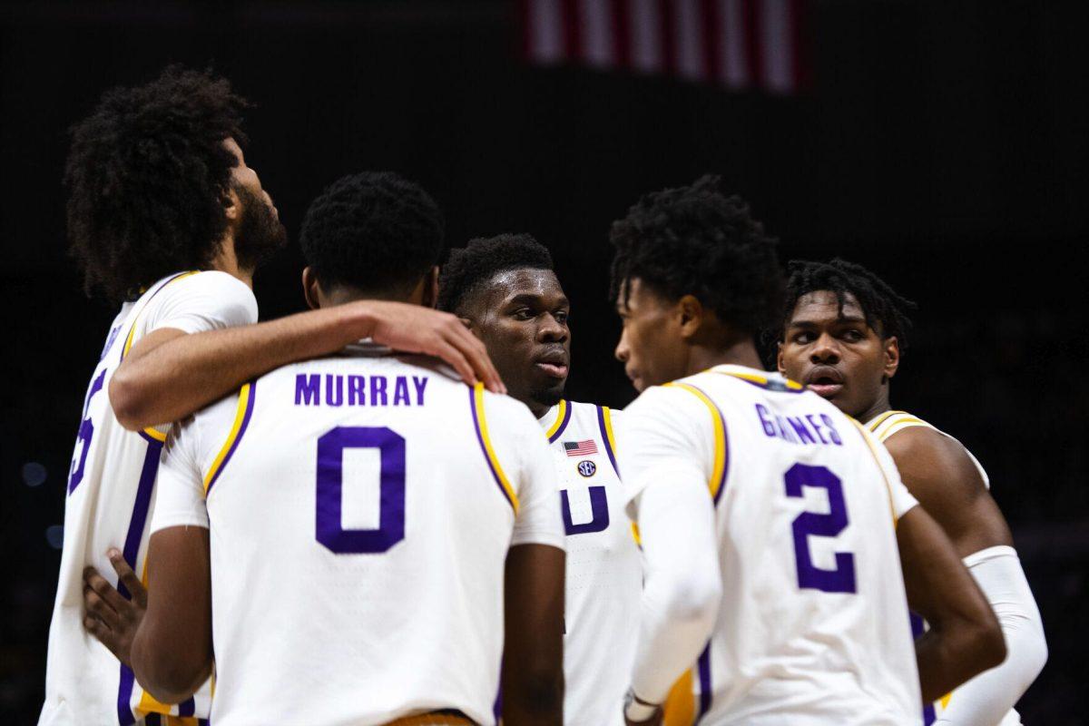 LSU men’s basketball senior forward Darius Days (4) stands in a huddle with sophomore forward Mwani Wilkinson (5), freshman center Efton Reid (15), sophomore guard Eric Gaines (2), and freshman guard Brandon Murray (0) Saturday, Jan. 15, 2022, during LSU’s 65-58 loss against Arkansas in the Pete Maravich Assembly Center on North Stadium Drive in Baton Rouge, La.
