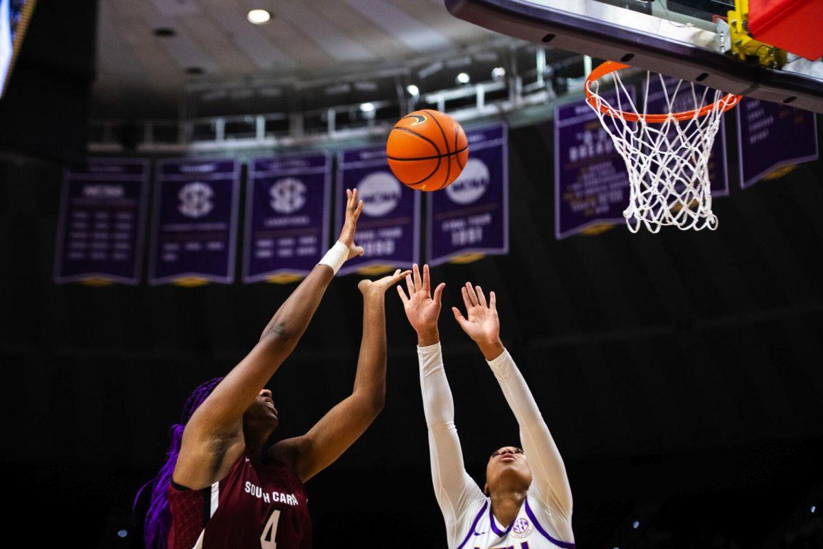LSU women’s basketball graduate student forward Autumn Newby (0) and South Carolina women’s basketball junior forward Aliyah Boston (4) try to grab the basketball Thursday, Jan. 06, 2022, during LSU’s 66-60 loss against South Carolina in the Pete Maravich Assembly Center on North Stadium Drive in Baton Rouge, La.