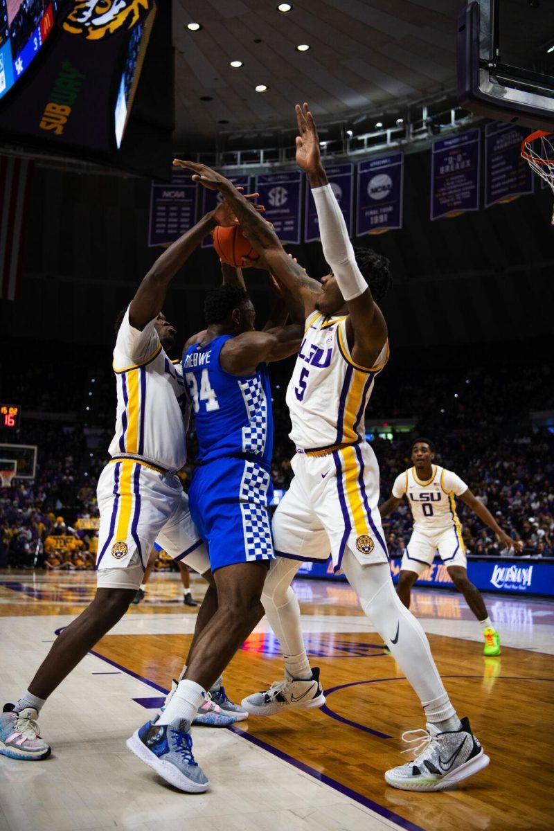 LSU men&#8217;s basketball sophomore forward Mwani Wilkinson (5) and senior forward Darius Days (4) double team against Kentucky junior forward Oscar Tshiebwe (34) Tuesday, Jan. 04, 2022, during LSU&#8217;s 56-50 win against Kentucky in the Pete Maravich Assembly Center on North Stadium Drive in Baton Rouge, La.