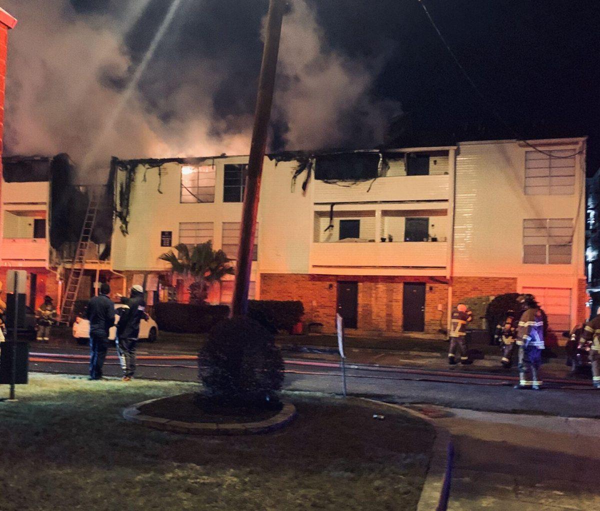 Firefighters work to put out the fire at the Bradshaw complex on Jan. 21.&#160;