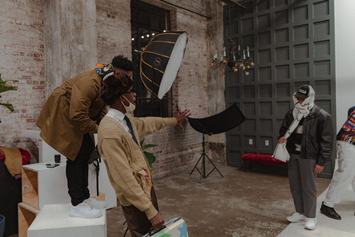 LSU sophomore construction management major and director of Project Innovate Studios Zahir Muhammad directs the posing for the photoshoot on Friday, Jan. 21, 2022, at Achroma Studio at 1509 Government Street in Baton Rouge, La.