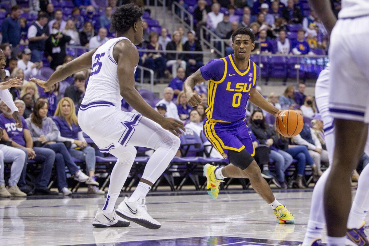 LSU guard Brandon Murray (0) looks to drive to the basket as TCU center Souleymane Doumbia (25) defends in the first half of an NCAA college basketball game in Fort Worth, Texas, Saturday, Jan. 29, 2022. TCU beat LSU 77-68. (AP Photo/Gareth Patterson)