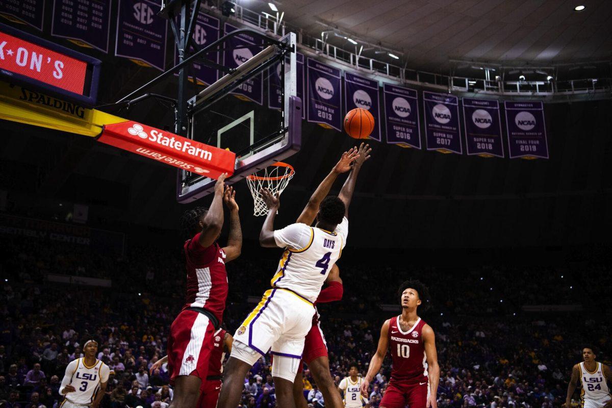 LSU men’s basketball senior forward Darius Days (4) shoots over Arkansas defenders Saturday, Jan. 15, 2022, during LSU’s 65-58 loss against Arkansas in the Pete Maravich Assembly Center on North Stadium Drive in Baton Rouge, La.
