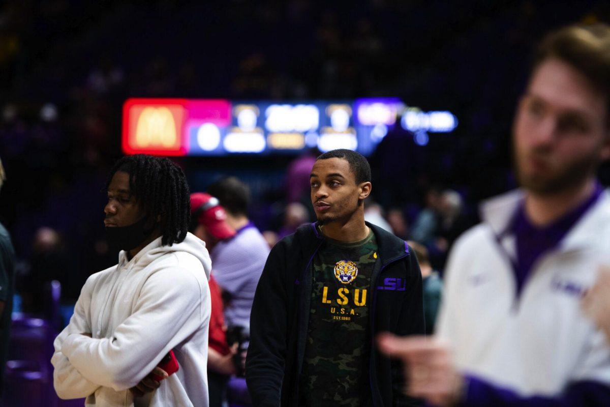 LSU men’s basketball senior guard Xavier Pinson (1) watches the team during warmups Saturday, Jan. 15, 2022, before LSU’s 65-58 loss against Arkansas in the Pete Maravich Assembly Center on North Stadium Drive in Baton Rouge, La.