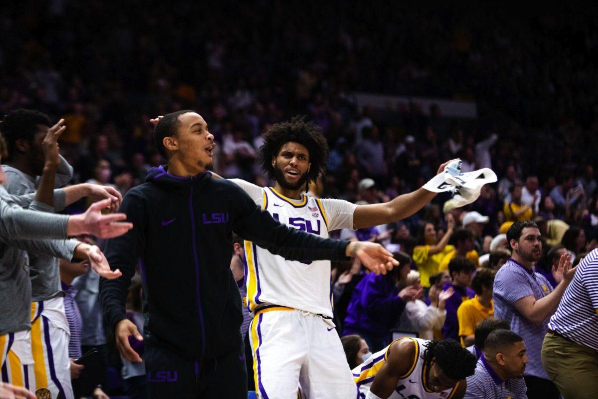 LSU men’s basketball freshman center Efton Reid (15) and senior guard Xavier Pinson (1) celebrate on the bench Jan. 15, 2022, during LSU’s 65-58 loss against Arkansas in the Pete Maravich Assembly Center on North Stadium Drive in Baton Rouge, La.