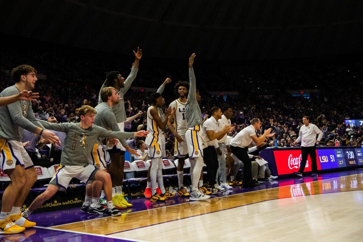 LSU men&#8217;s basketball team cheers on the team after a big time play Tuesday, Jan. 04, 2022, during LSU&#8217;s 56-50 win against Kentucky in the Pete Maravich Assembly Center on North Stadium Drive in Baton Rouge, La.