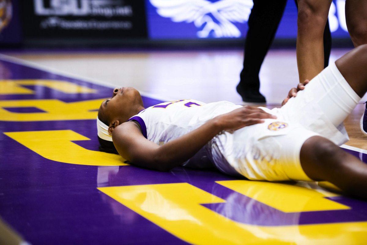 LSU women’s basketball graduate student guard Khayla Pointer (3) lays on the floor after getting fouled Sunday, Jan. 16, 2022, during LSU’s 82-64 win against Vanderbilt in the Pete Maravich Assembly Center on North Stadium Drive in Baton Rouge, La.