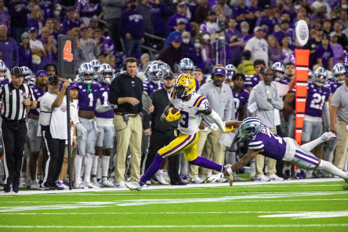 LSU football senior wide receiver Jontre Kirklin (13) continues the drive Tuesday, Jan. 4, 2022, after making a first down during LSU&#8217;s 42-20 loss against Kansas State at NRG Stadium in Houston, TX.