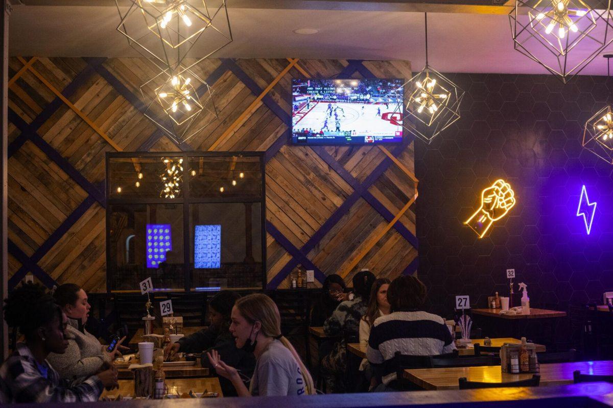 Customers sit in the dining area Tuesday, Jan. 18, 2022, at Rock Paper Taco on 166 W Chimes St. in Baton Rouge, La.