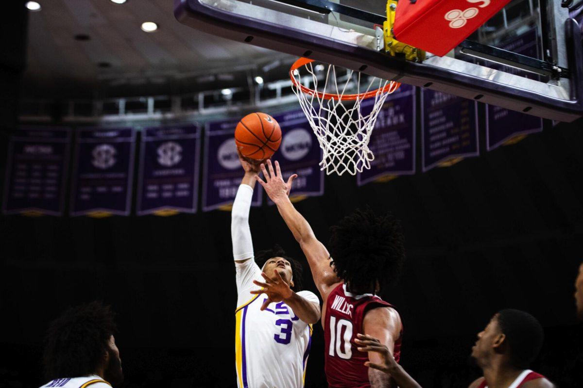 LSU men’s basketball freshman forward Alex Fudge (3) shoots a shot in the paint Saturday, Jan. 15, 2022, during LSU’s 65-58 loss against Arkansas in the Pete Maravich Assembly Center on North Stadium Drive in Baton Rouge, La.