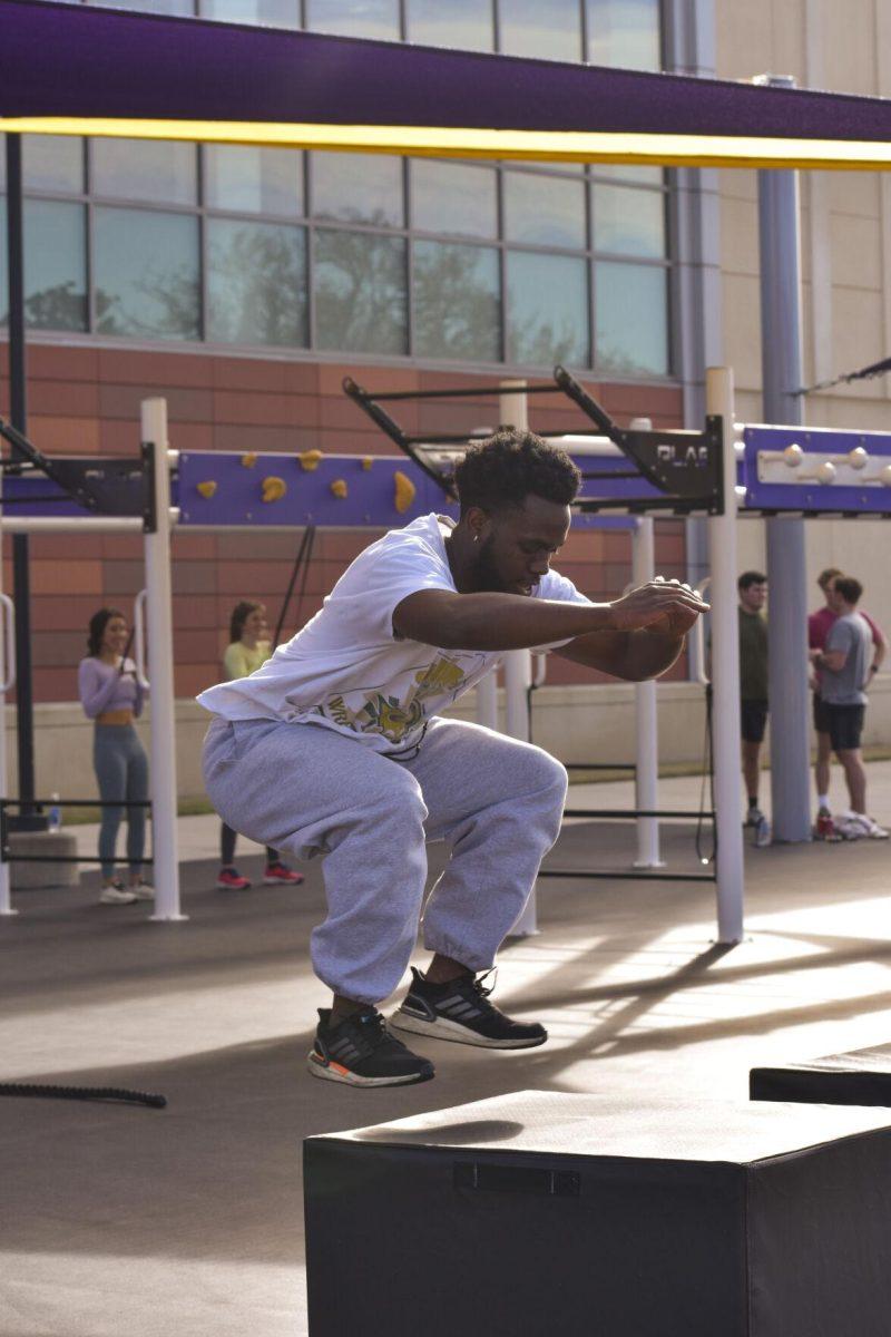 An LSU student jumps on and off of a plyo box Wednesday, Jan. 26, 2022, at the UREC Outdoor Space.