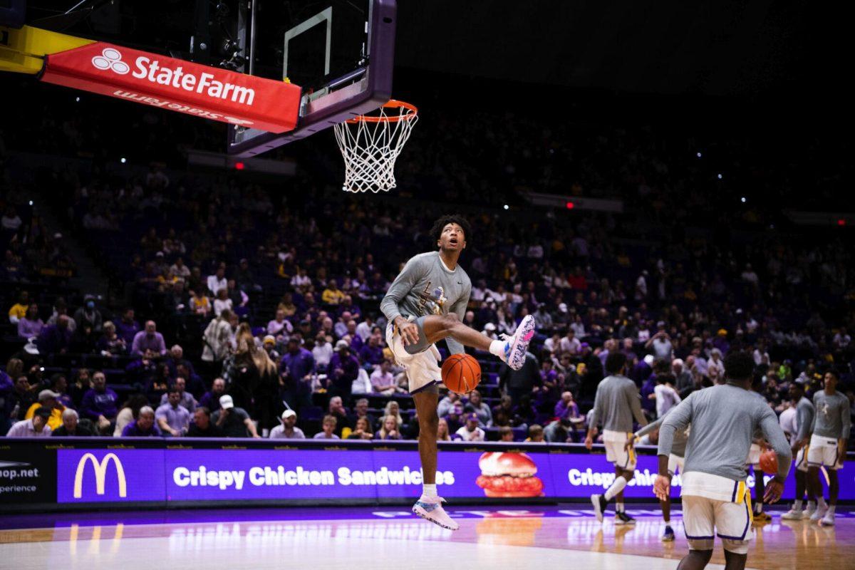 LSU men’s basketball sophomore guard Eric Gaines (2) performs a between the legs dunk during warmups Saturday, Jan. 15, 2022, before LSU’s 65-58 loss against Arkansas in the Pete Maravich Assembly Center on North Stadium Drive in Baton Rouge, La.