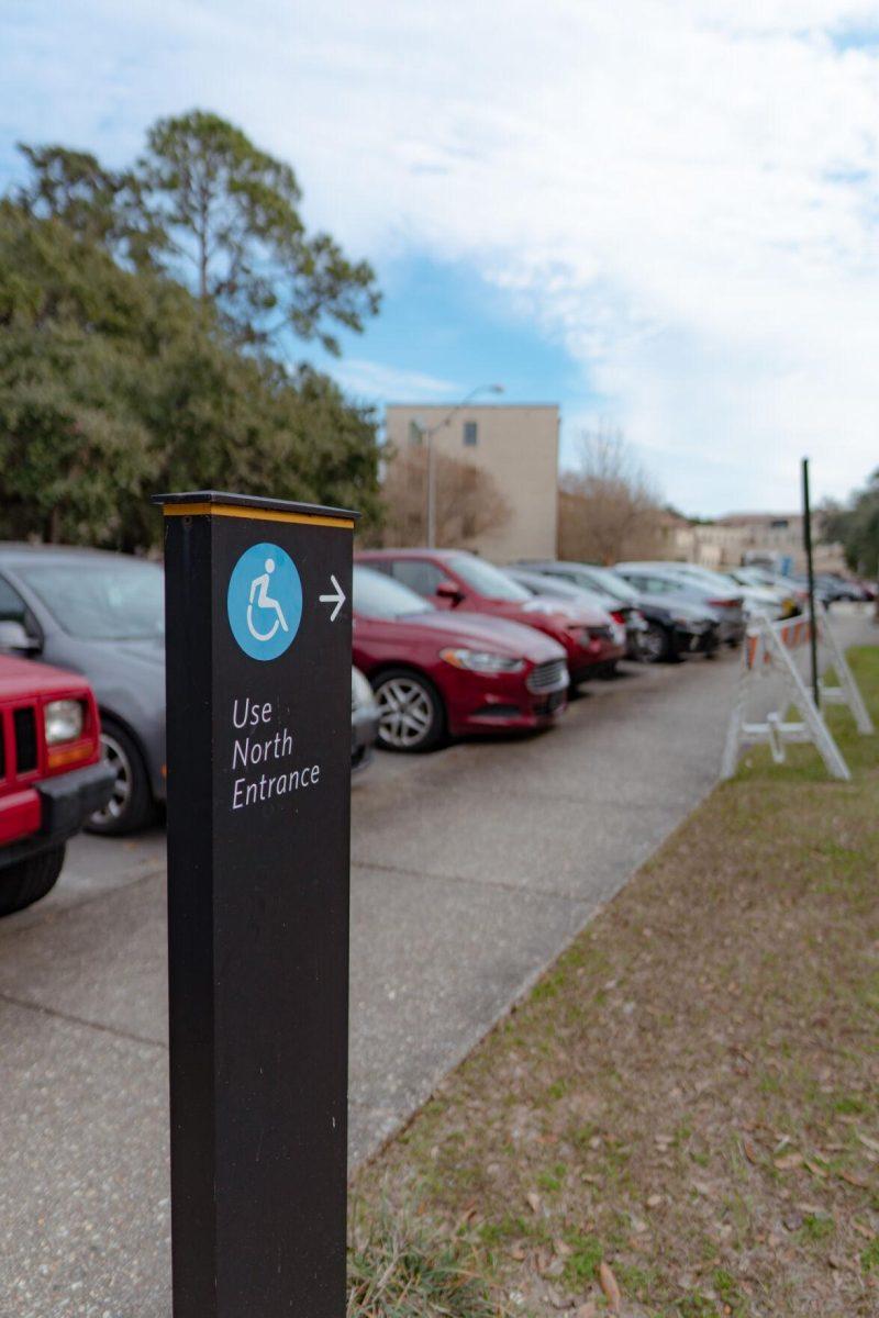 A sign points to the accessible entrance on Monday, Jan. 24, 2022, at Acadian Hall in Baton Rouge, La.