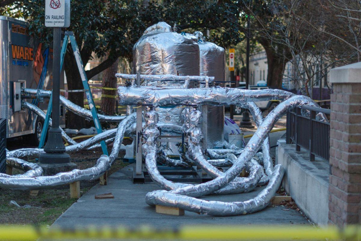 A network of pipes pump water on Sunday, Jan. 23, 2022, into South Hall on Cypress Drive in Baton Rouge, La.