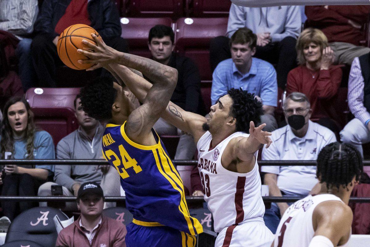 Alabama forward James Rojas (33) blocks a shot from LSU forward Shareef O'Neal (24) during the second half of an NCAA college basketball game Wednesday, Jan. 19, 2022, in Tuscaloosa, Ala. (AP Photo/Vasha Hunt)