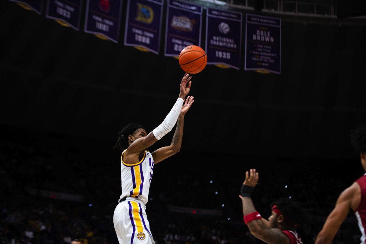 LSU men’s basketball freshman guard Justice Williams (11) goes up for a shot Saturday, Jan. 15, 2022, during LSU’s 65-58 loss against Arkansas in the Pete Maravich Assembly Center on North Stadium Drive in Baton Rouge, La.