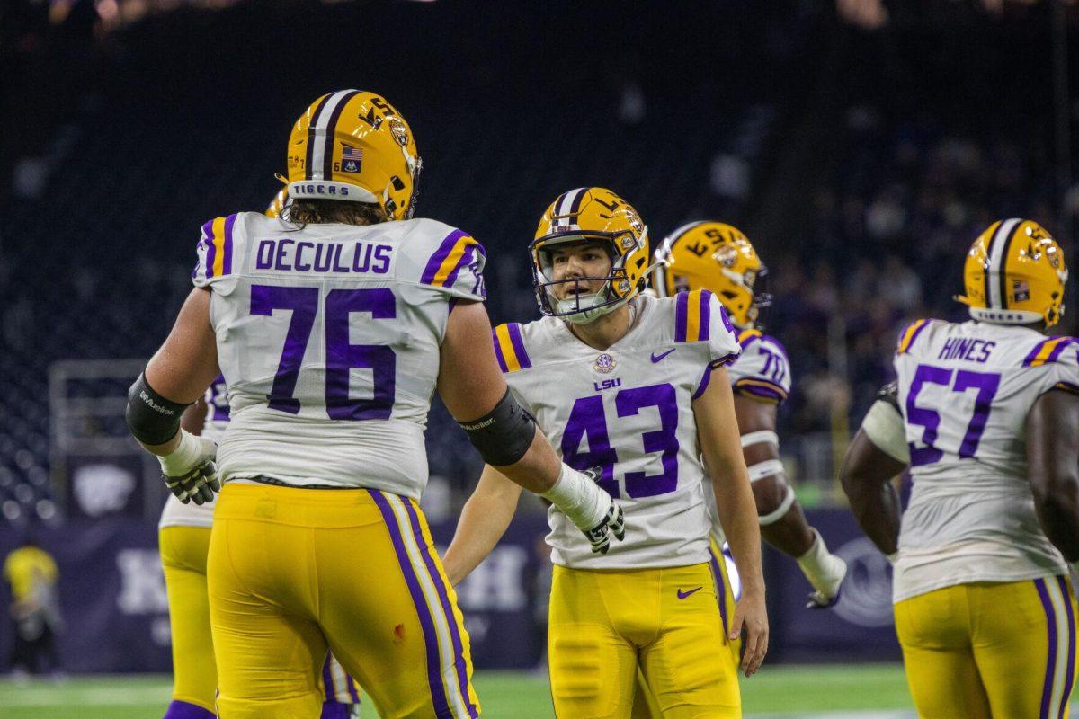 LSU football junior placekicker Preston Stafford (43) and graduate student offensive tackle Austin Deculus (76) celebrate a successful extra point Tuesday, Jan. 4, 2022, during LSU&#8217;s 42-20 loss against Kansas State at NRG Stadium in Houston, TX.