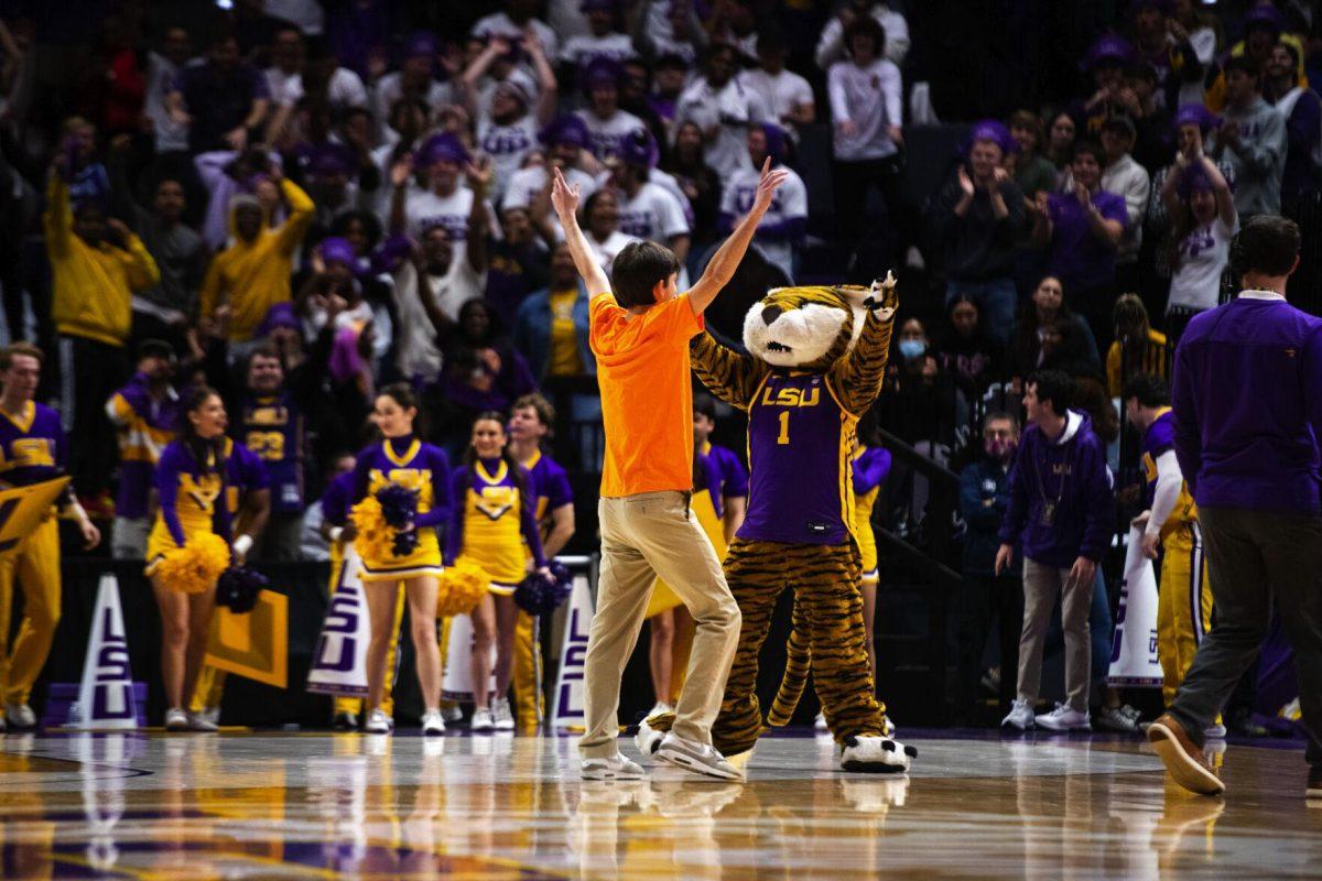 A LSU fan hits a halfcourt shot to win free Whataburger for a year during halftime Saturday, Jan. 15, 2022, during LSU’s 65-58 loss against Arkansas in the Pete Maravich Assembly Center on North Stadium Drive in Baton Rouge, La.
