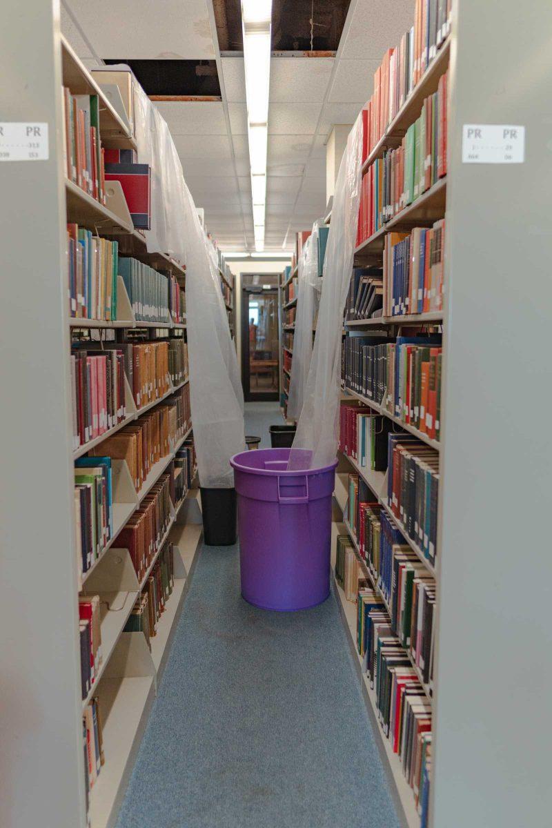 Several tarps lead into garbage cans on Tuesday, Jan. 18, 2022, to collect any water leaking from the ceiling of the LSU Library in Baton Rouge, La.