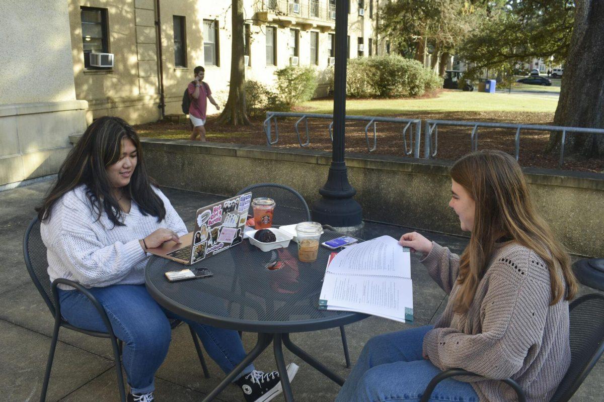 LSU English Literature freshman Jadalyn Souvannasy and Animal Sciences freshman Jordan McNair chat Tuesday, Jan. 18, 2022, outside Barnes and Nobles on 2 Union Square in Baton Rouge, La.