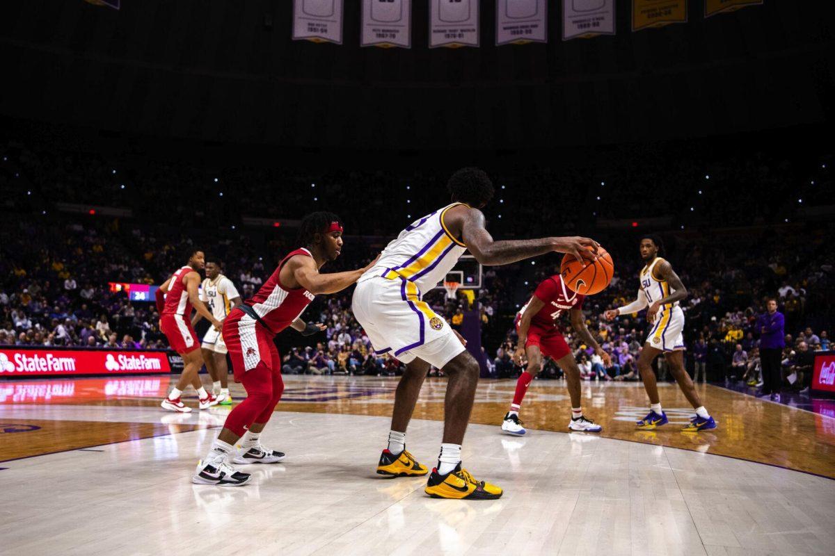 LSU men’s basketball sophomore forward Tari Eason (13) posts up an Arkansas defender Jan. 15, 2022, during LSU’s 65-58 loss against Arkansas in the Pete Maravich Assembly Center on North Stadium Drive in Baton Rouge, La.