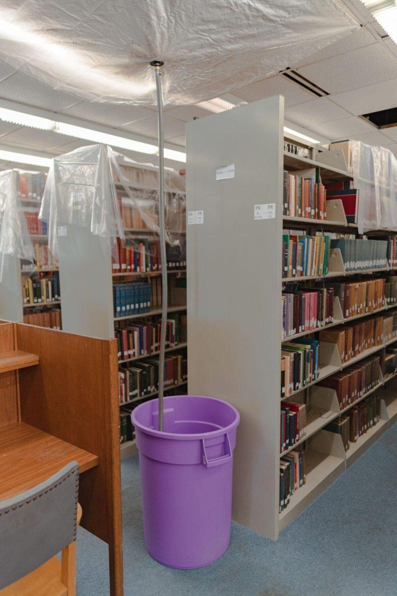 A tube leads into a garbage can on Tuesday, Jan. 18, 2022, to collect any water leaking from the roof of the LSU Library in Baton Rouge, La.