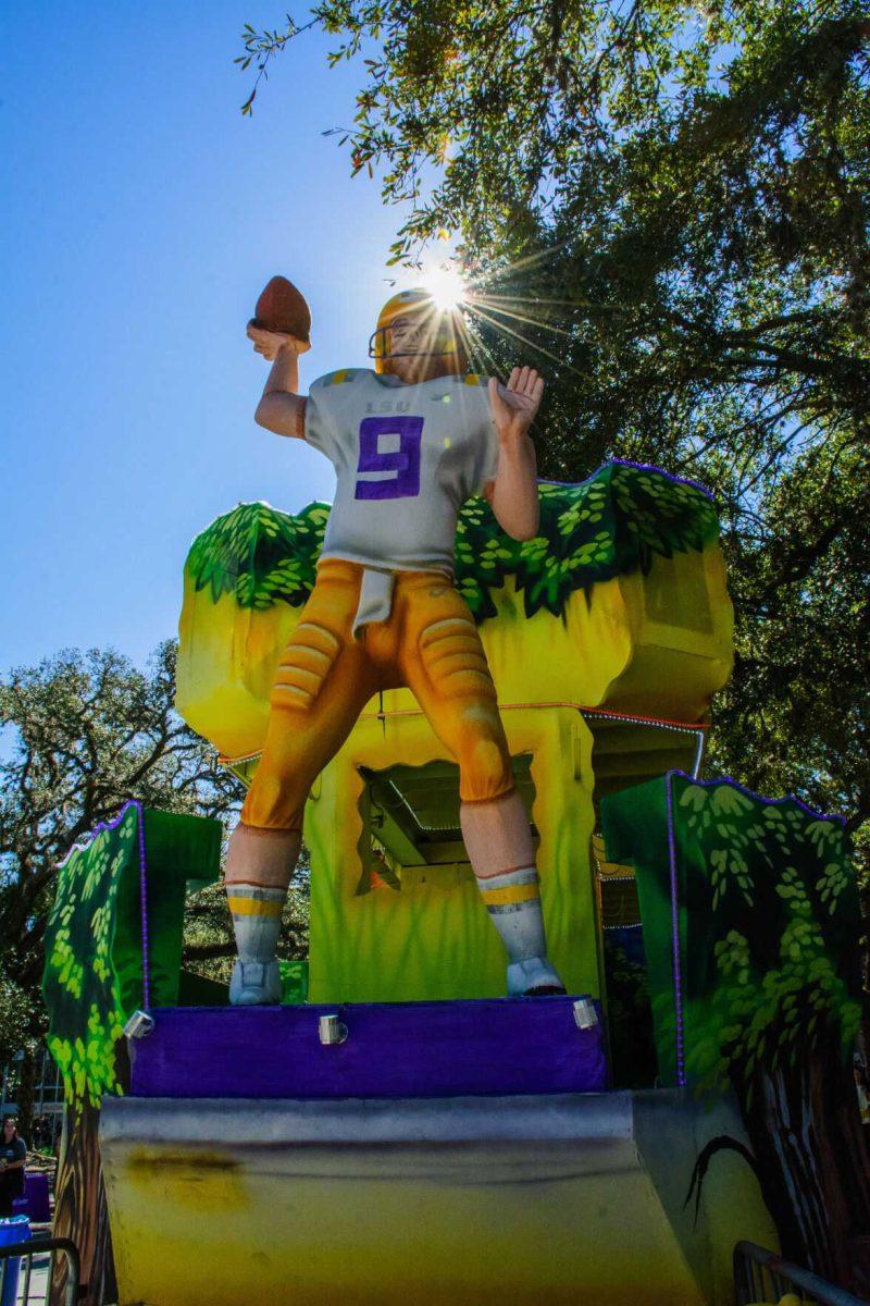 LSU alumni quarterback Joe Burrow sits at the front of the LSU themed float Wednesday, Feb. 9, 2022 during the LSU Student Activities Board Mardi Gras Mambo event on Tower Drive at LSU's campus in Baton Rouge, La.