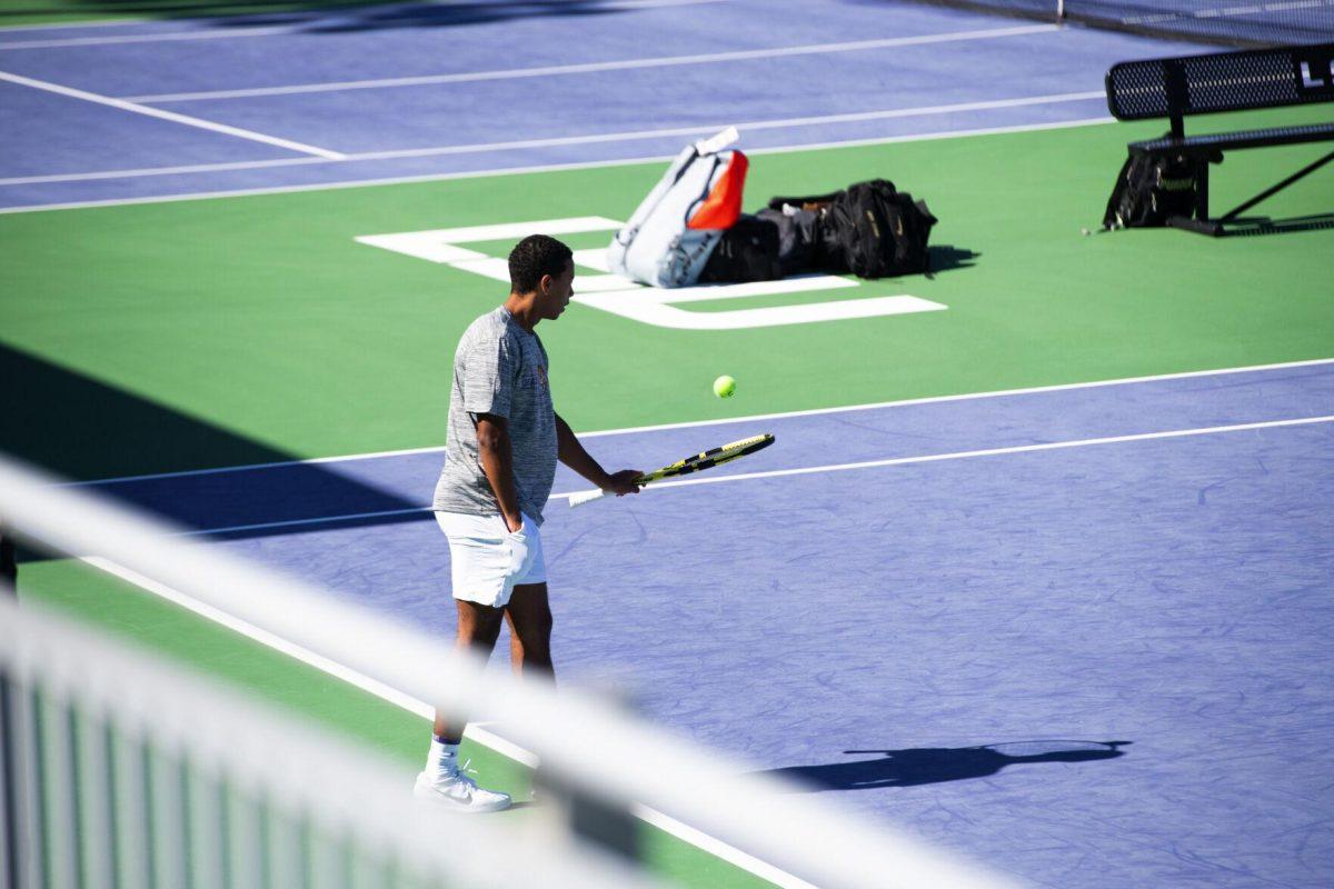 LSU men's tennis junior Kent Hunter hits the ball with his racquet Sunday, Feb. 13, 2021 during LSU's 6-1 win over Purdue at the LSU Tennis Complex on Gourrier Avenue in Baton Rouge, La.
