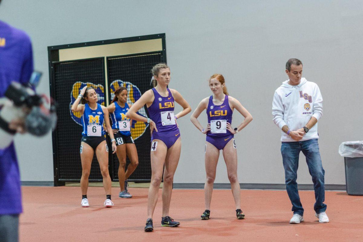 LSU track and field freshmen Callie Hardy (left) and Sophie Martin (right) await the start of their race on Friday, Feb. 4, 2022, during the Bayou Bengal indoor track meet at the Carl Maddox Field House on Nicholson Drive in Baton Rouge, La.