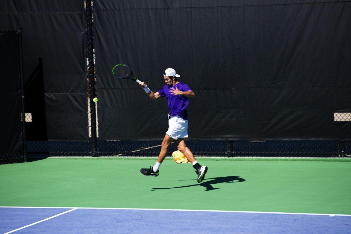 LSU men's tennis sophomore Benjamin Ambrosio hits the tennis ball Sunday, Feb. 13, 2021 during LSU's 6-1 win over Purdue at the LSU Tennis Complex on Gourrier Avenue in Baton Rouge, La.