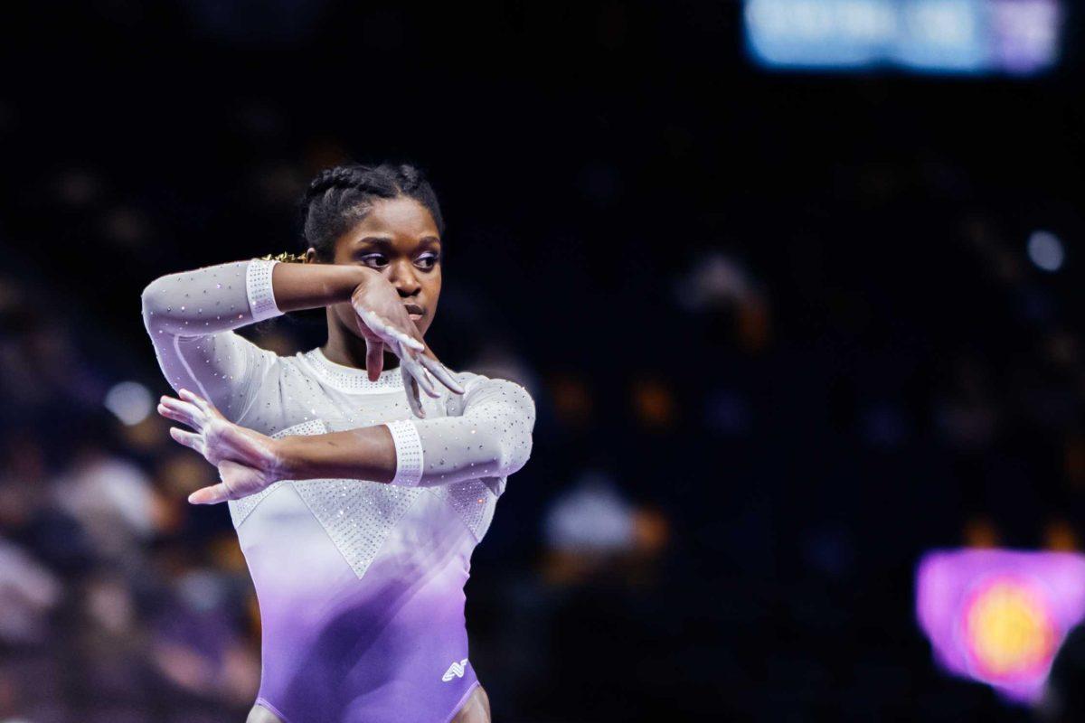 LSU gymnastics sophomore all-around Kiya Johnson performs her balance beam routine Friday, March 3, 2021 during LSU's 197.875-196.175 win over Missouri in the Pete Maravich Assembly Center on N. Stadium Drive in Baton Rouge, La.